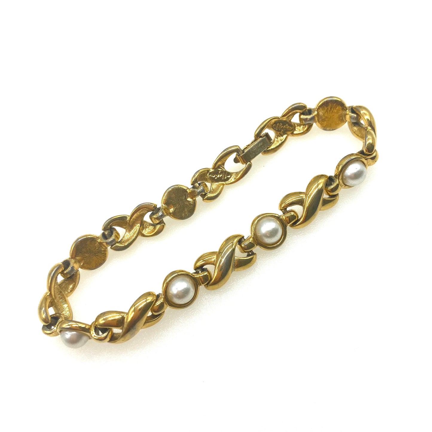 Napier Criss Cross Bracelet with Imitation pearls Pat 4.774.743