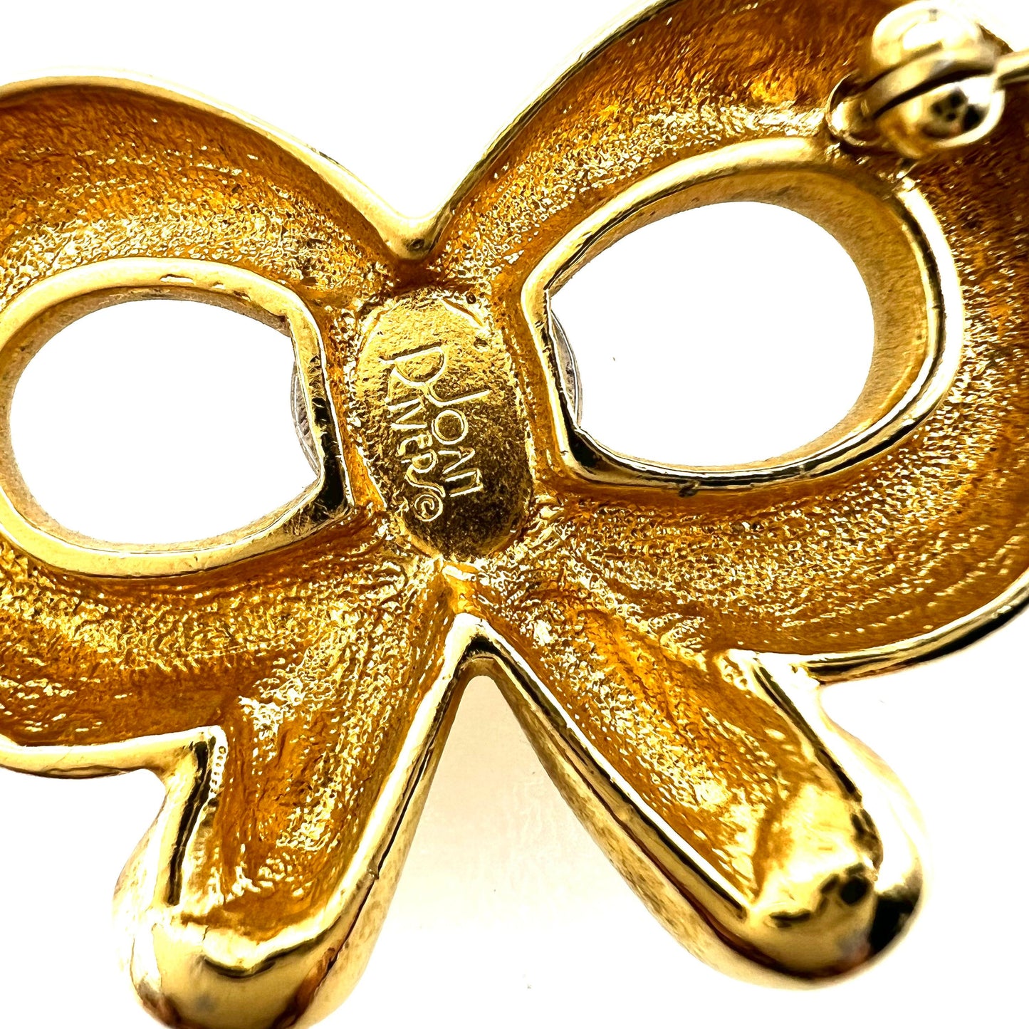 Broche à nœud stylisée Joan Rivers avec cabochons en verre de style Gripoix