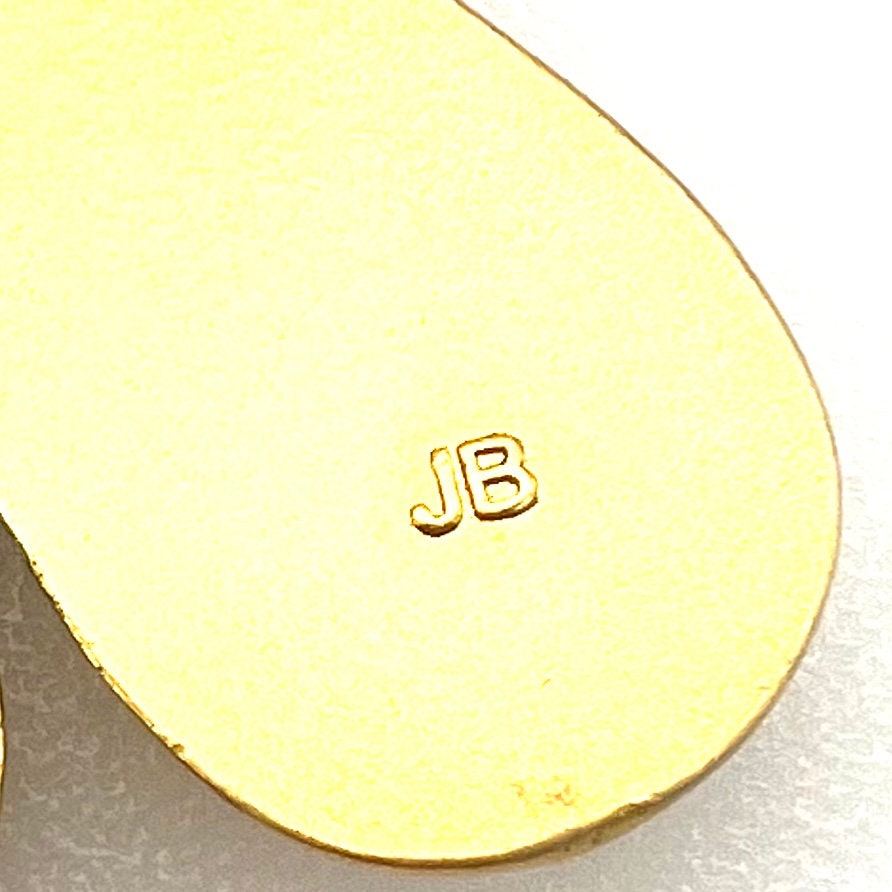 Broche avec logo en émail violet Nina Ricci