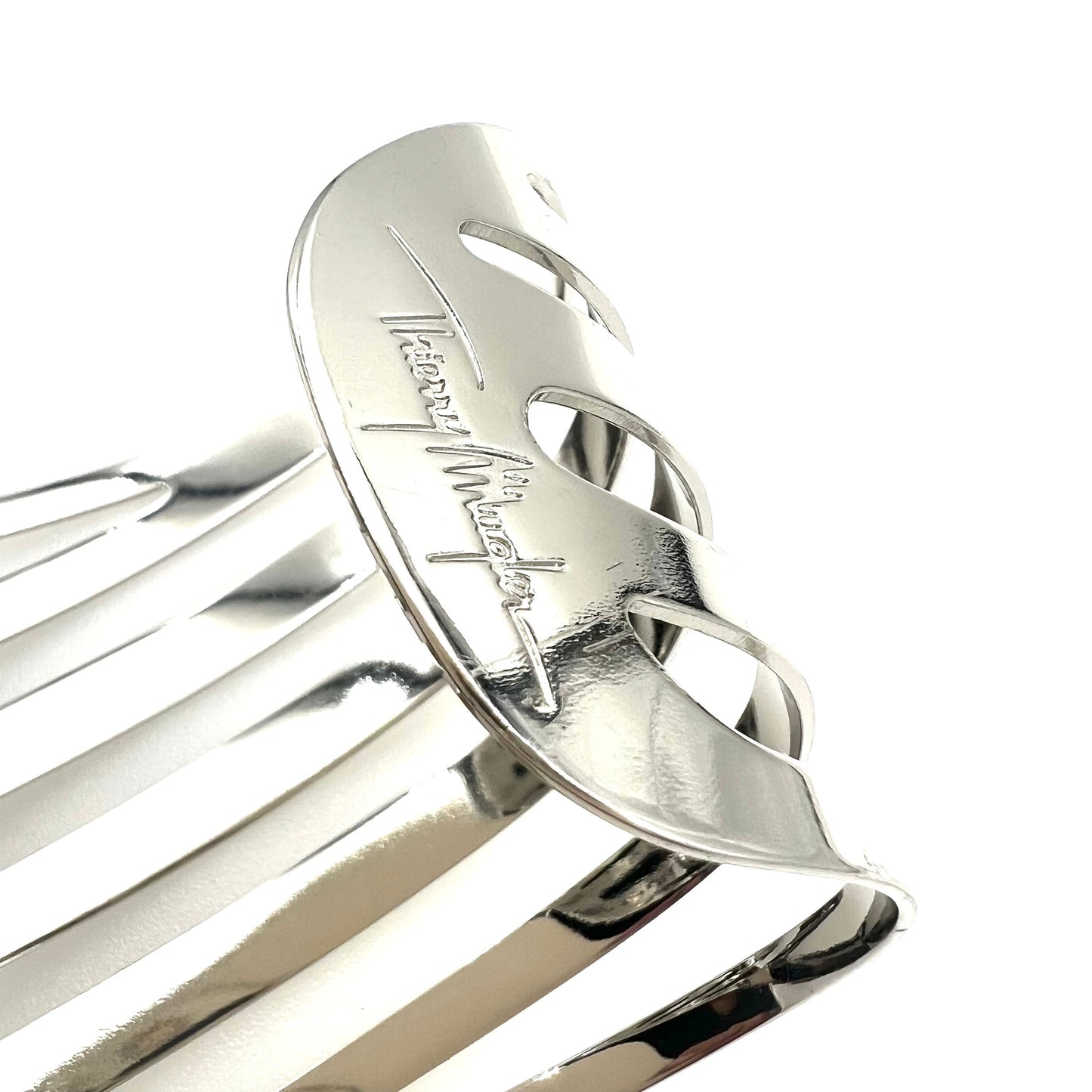Manchette tourbillon argentée ajourée Thierry Mugler