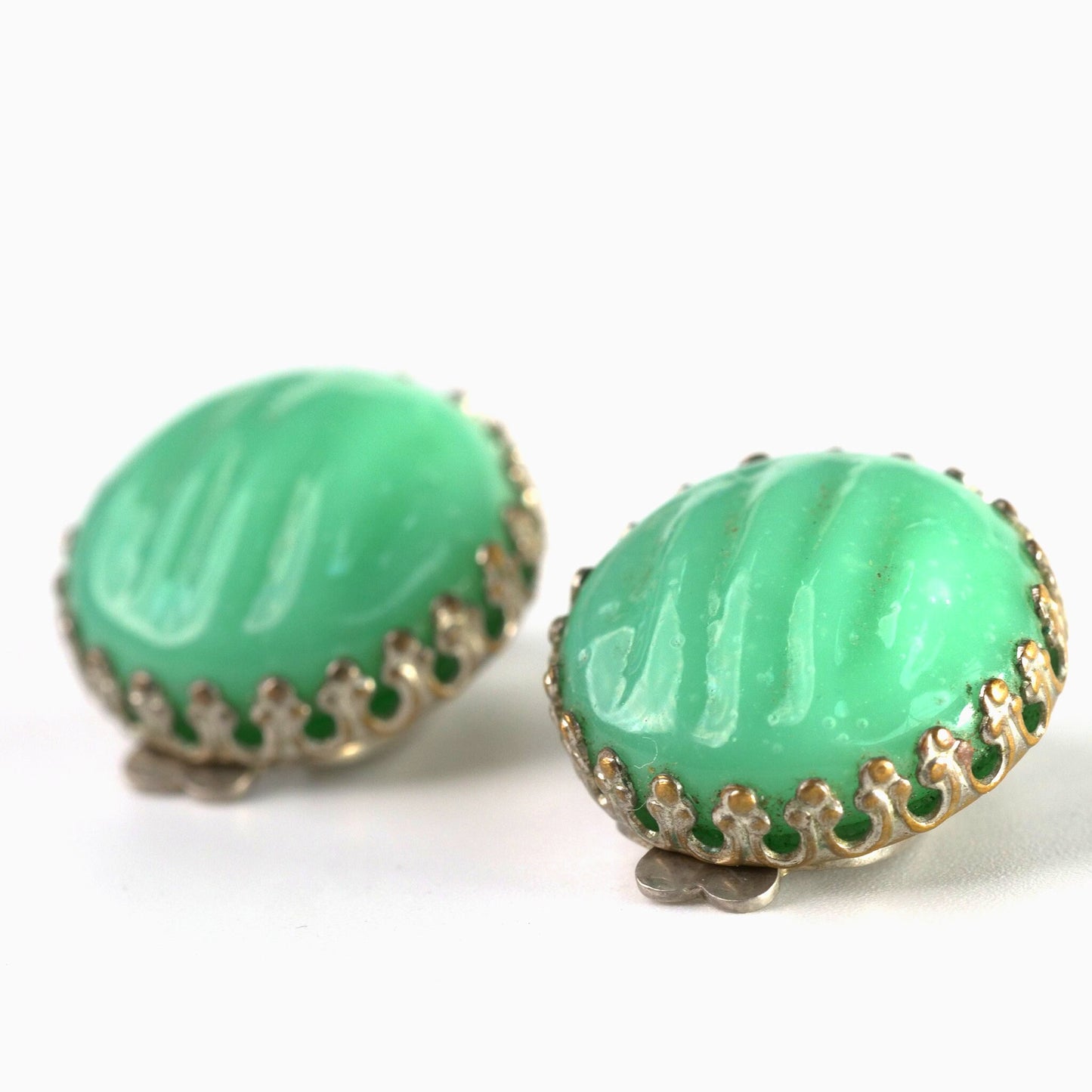 A Pair of Vintage Green Molded Glass Clip On Earrings with Dog Tooth Prong Setting
