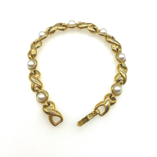 Napier Criss Cross Bracelet with Imitation pearls Pat 4.774.743